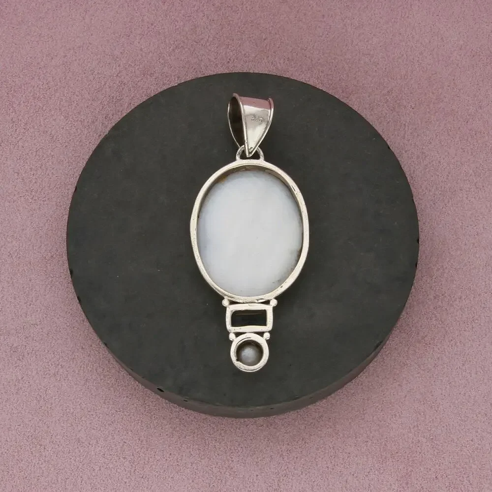 sterling silver topaz & carved mother of pearl silhouette pendant